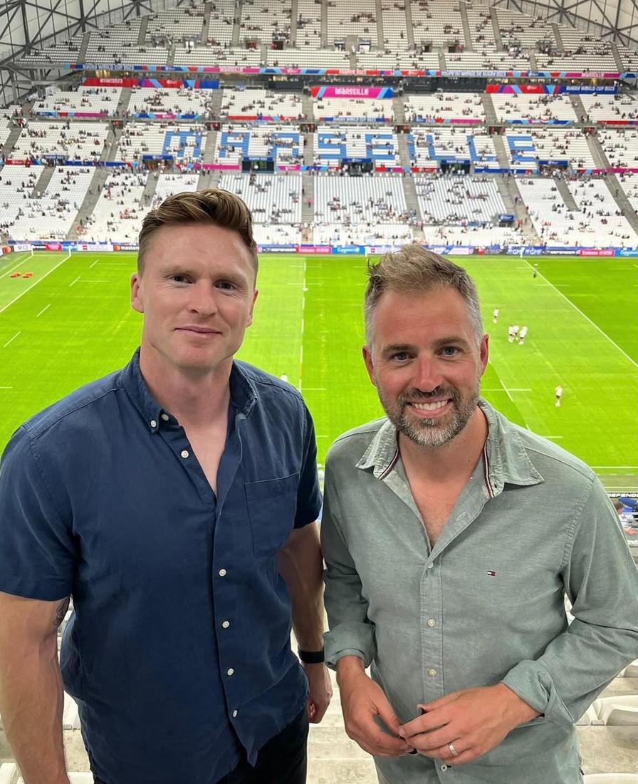 Chris and a colleague in the stands in Marseille
